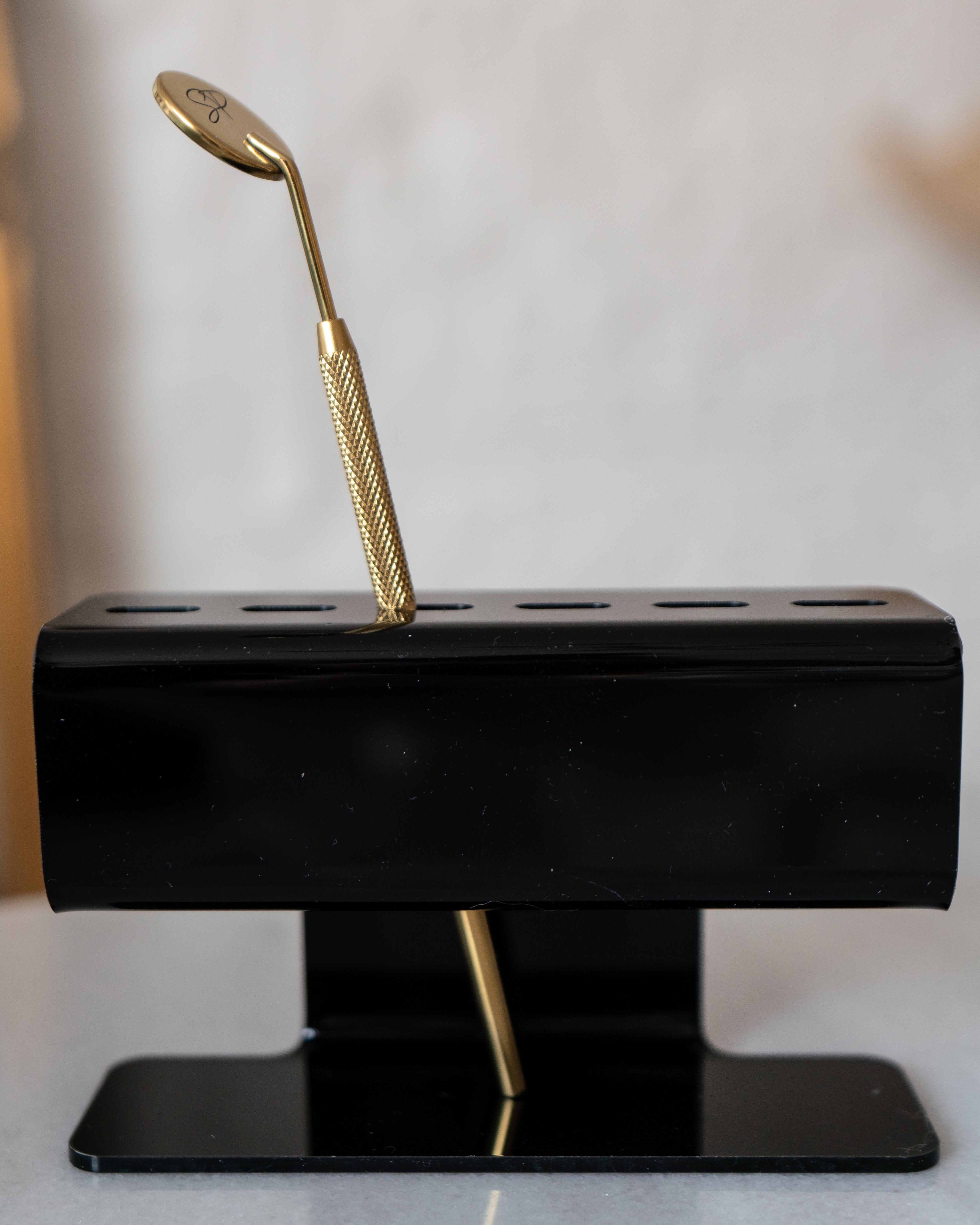 Black tweezer holder