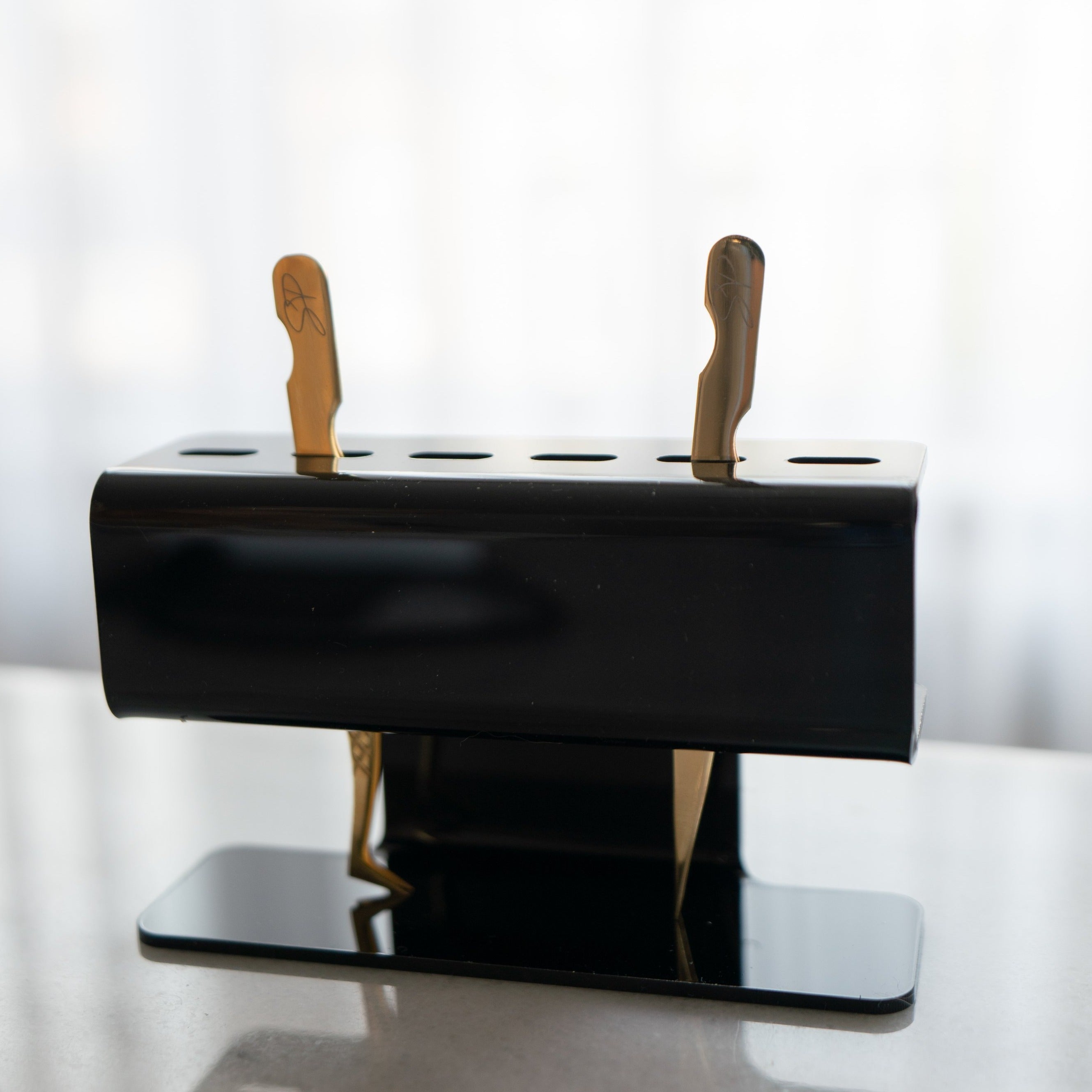 Black tweezer holder